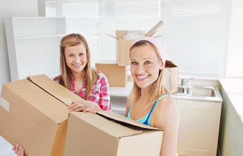 Local removals van team handling transport and unloading